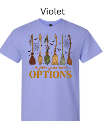 A Girl's Gotta Have Options witch t-shirt violet lavender with six witch brooms spiderwebs bats Halloween cozy fall design warm orange text women's tee