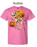 Skeleton T-Rex dinosaur Halloween t-shirt Azalea pink with raptor holding jack-o-lantern pumpkin candy bucket orange moon bats stars spooky prehistoric graphic tee