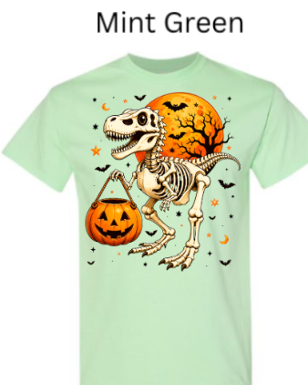 Skeleton T-Rex dinosaur Halloween t-shirt Mint green with dinosaur skeleton raptor holding pumpkin bucket orange moon bats stars fresh fall graphic tee