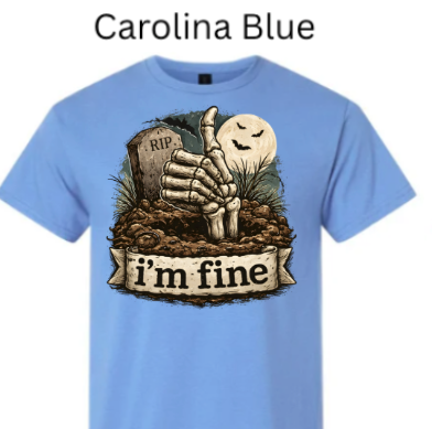 "Carolina blue t-shirt featuring dark humor skeleton hand graveyard graphic, thumbs up pose, RIP tombstone, grinning moon, 'I'm Fine' slogan banner"