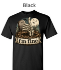 "Black t-shirt featuring Halloween skeleton hand emerging from dirt giving thumbs up, ghost moon face, RIP headstone, 'I'm Fine' ribbon text graphic"