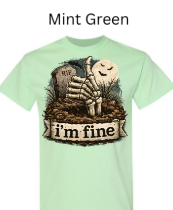 "Mint green crew neck t-shirt with dark humor Halloween design: skeleton hand thumbs up from graveyard, smiling moon ghost, 'I'm Fine' banner"