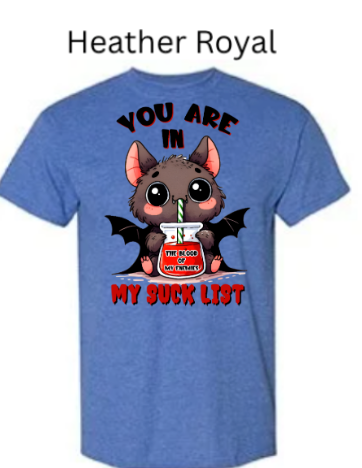 "Blue royal heather t-shirt featuring kawaii vampire bat design, drinking blood cocktail through striped straw, 'You Are In My Suck List' statement, cute bat face with rosy cheeks"