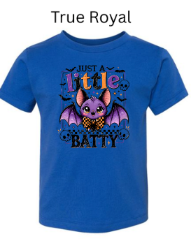 "Royal blue youth t-shirt displaying 'Just A Little Batty' purple bat design with bowtie, candy corn colored lettering, skull accents, small flying bats, kids Halloween apparel"