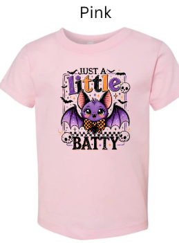 "Soft pink baby onesie with Just A Little Batty design: purple bat with bowtie, large pink ears, skull border decorations, multicolored text, infant Halloween bodysuit"