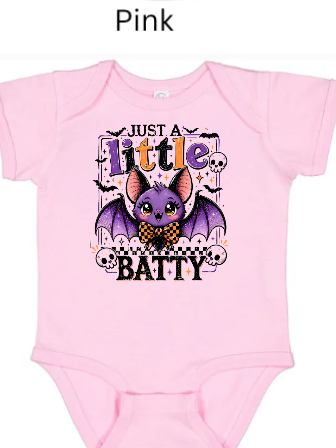 "Light pink children's t-shirt featuring cute purple Halloween bat wearing checkered bowtie, 'Just A Little Batty' phrase, decorative skulls and bats, toddler girl Halloween shirt"