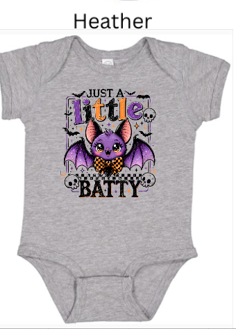 "Heather grey infant bodysuit featuring cute purple Halloween bat with orange-black checkered bowtie, 'Just A Little Batty' text, decorative skull border, baby Halloween outfit"