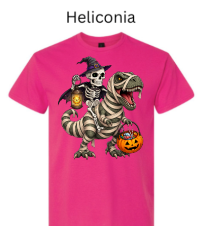 "Hot pink heliconia t-shirt showing skeleton witch riding mummy-wrapped dinosaur, jack-o'-lantern lanterns glowing, Halloween candy gathering, fun seasonal graphic tee"