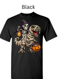 "Black crew neck t-shirt displaying skeleton witch riding wrapped T-Rex dinosaur, jack-o'-lantern lanterns, pumpkin candy basket, spooky Halloween dino witch design"