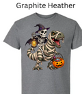"Dark graphite heather t-shirt with witch skeleton on bandaged T-Rex, glowing pumpkins, treat-filled basket, mummy dinosaur with green eyes, Halloween graphic apparel"