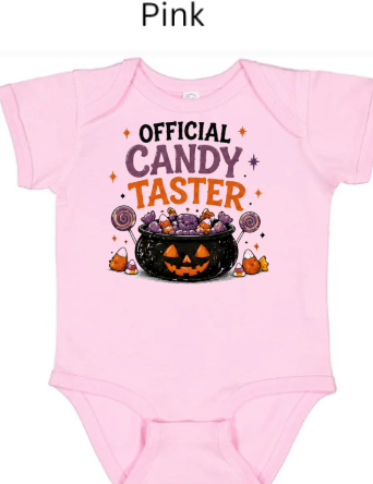 Official Candy Taster baby onesie in light pink with colorful pumpkin candy cauldron lollipops and candy corn — adorable Halloween outfit for baby girls first Halloween