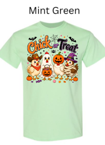 Chick or Treat Halloween graphic tee in mint green displaying adorable cartoon chickens in Halloween costumes surrounded by festive bats, spiderwebs, pumpkins, and candies on light mint colored shirt

