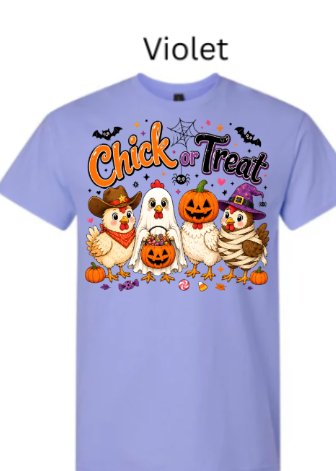 Lavender violet t-shirt with playful Chick or Treat Halloween graphic featuring cute cartoon chickens dressed as cowboy, ghost, pumpkin, witch, and mummy with seasonal decorations on soft purple heather fabric