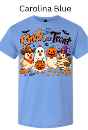 Light Carolina blue Halloween t-shirt featuring "Chick or Treat" graphic with cartoon farm chickens in fun costumes including bats, spiders, pumpkins and candy on soft powder blue fabric background