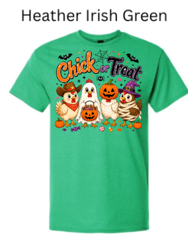 Halloween chicken shirt in heather Irish green featuring playful "Chick or Treat" typography and four costumed cartoon chicks plus pumpkin character with bats and fall elements on emerald green heather background