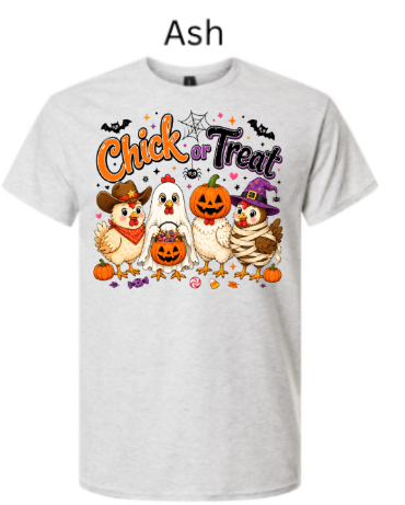 Classic ash grey t-shirt with bold "Chick or Treat" Halloween design displaying five adorable costumed chickens with bats, pumpkins, spiders and candy accents on neutral light grey heather background