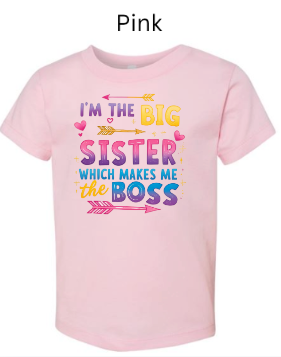 Pink Bella+Canvas 3001T toddler tee with "I'M THE BIG SISTER WHICH MAKES ME BOSS" design. Colorful gradient text with arrows and hearts. Sweet big sister announcement shirt in pink.