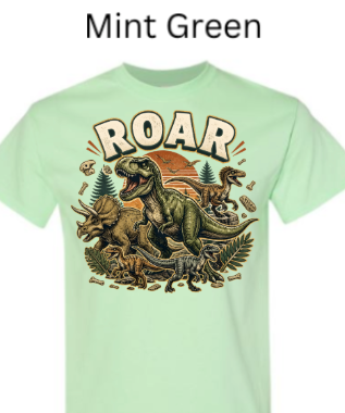 "Mint green children's t-shirt with colorful dinosaur illustration and ROAR text"